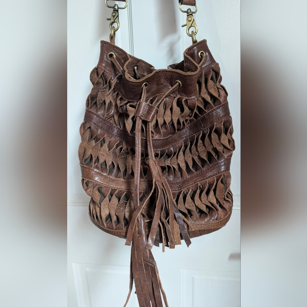 Brown leather Lost & Found Brand bucket bag.